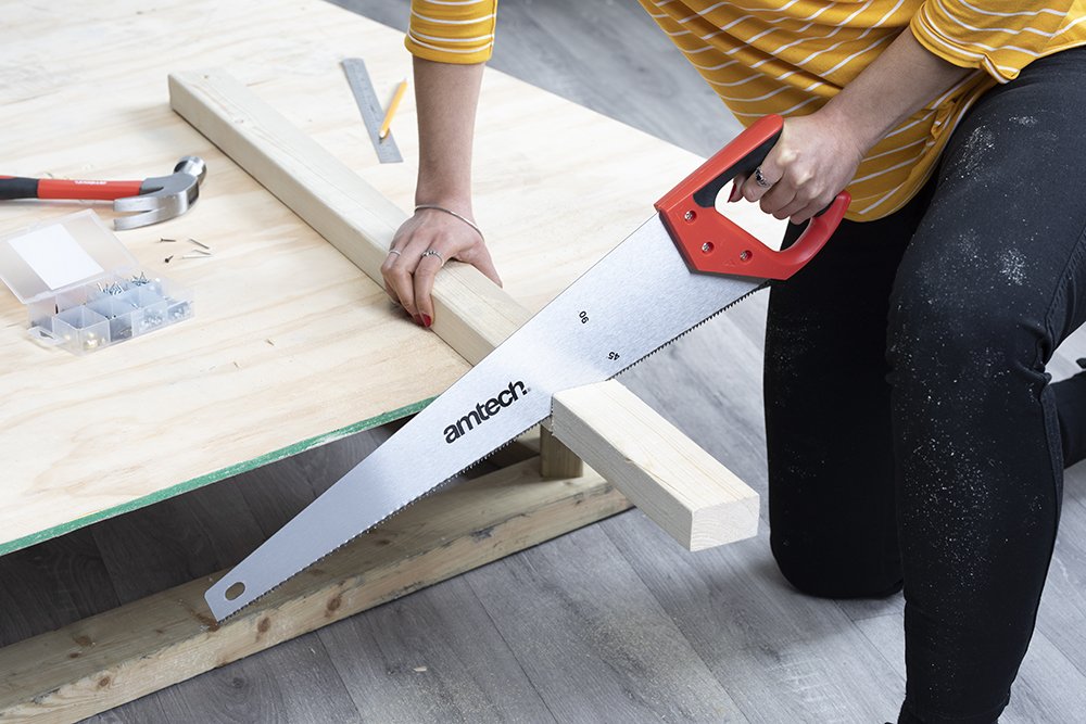 Person sawing wood